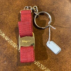 Ferragamo burgundy bag charm